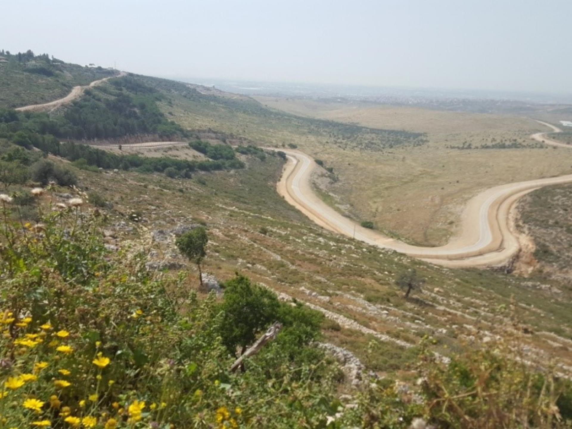 The”security” fence track – prior to the erection of the fence, villagers of Sur would descend the hill on donkey-back and reach their farmland directly. Now this is impossible.