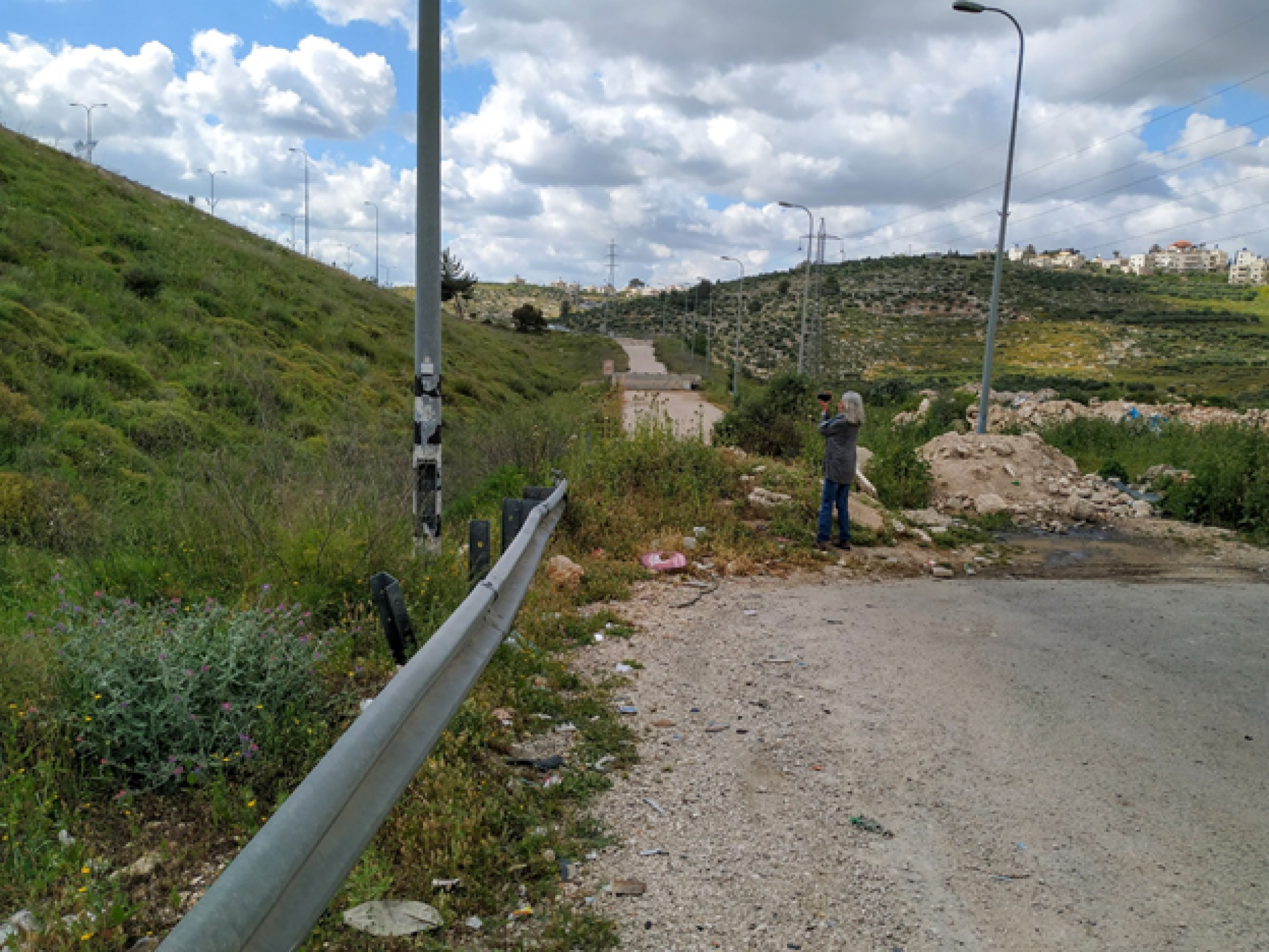 The barrier at the entrance to Beit Likiya village. Road 443 beyond the ‘security fence’ was paved on the Palestinians’ lands and is out of bounds for them
