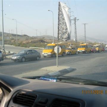 Long line of cars waiting at the checkpoint of Zaarta Tapuach