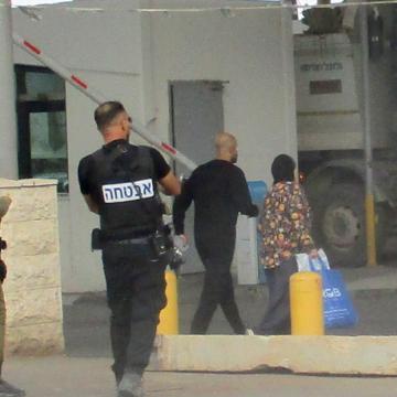 Qalandiya. A woman and a man were taken off the bus to be checked