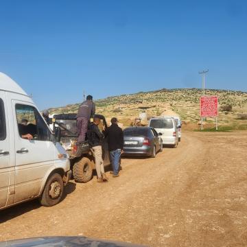 Workers from the West Bank who worked in settlements in the Jordan Valley Waiting to move home