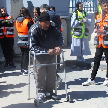Qalandiya: Supported by a walker, the man stood embarrassed, helpless and waited
