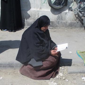 Qalandiya: Sitting on the roadside and praying